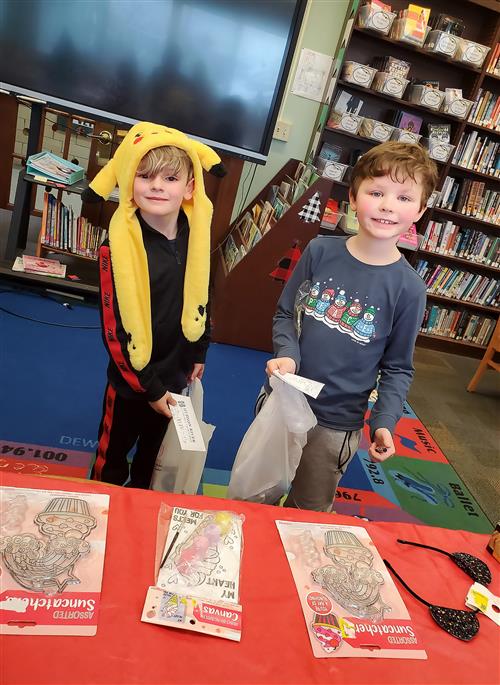 Two boys smiling in Santa's Workshop